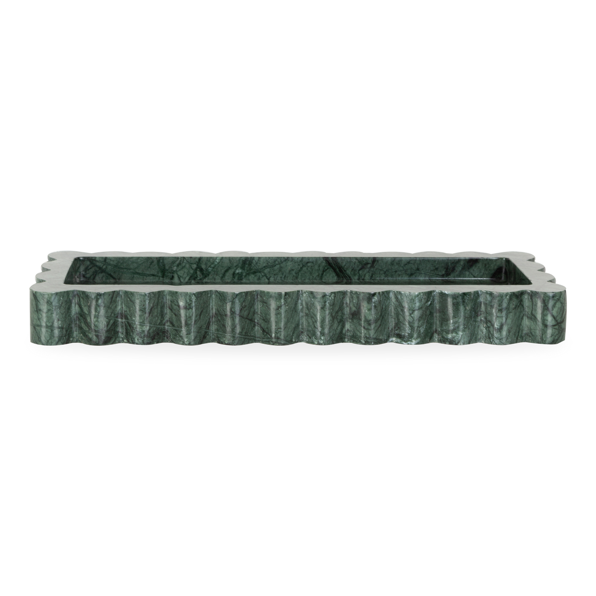 The Scallop Marble Tray is a sculptural tray cut from a single piece of solid marble with scalloped edges, hand-finished by artisans in a growing stone atelier in Rajasthan, India.