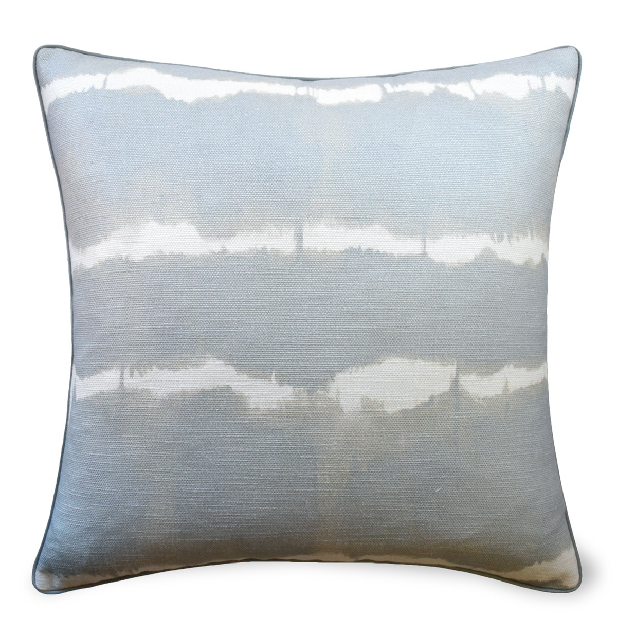 The Frequency Pillow has a Shibori tie-dyed effect on linen, reversing to solid linen back and piped edges.