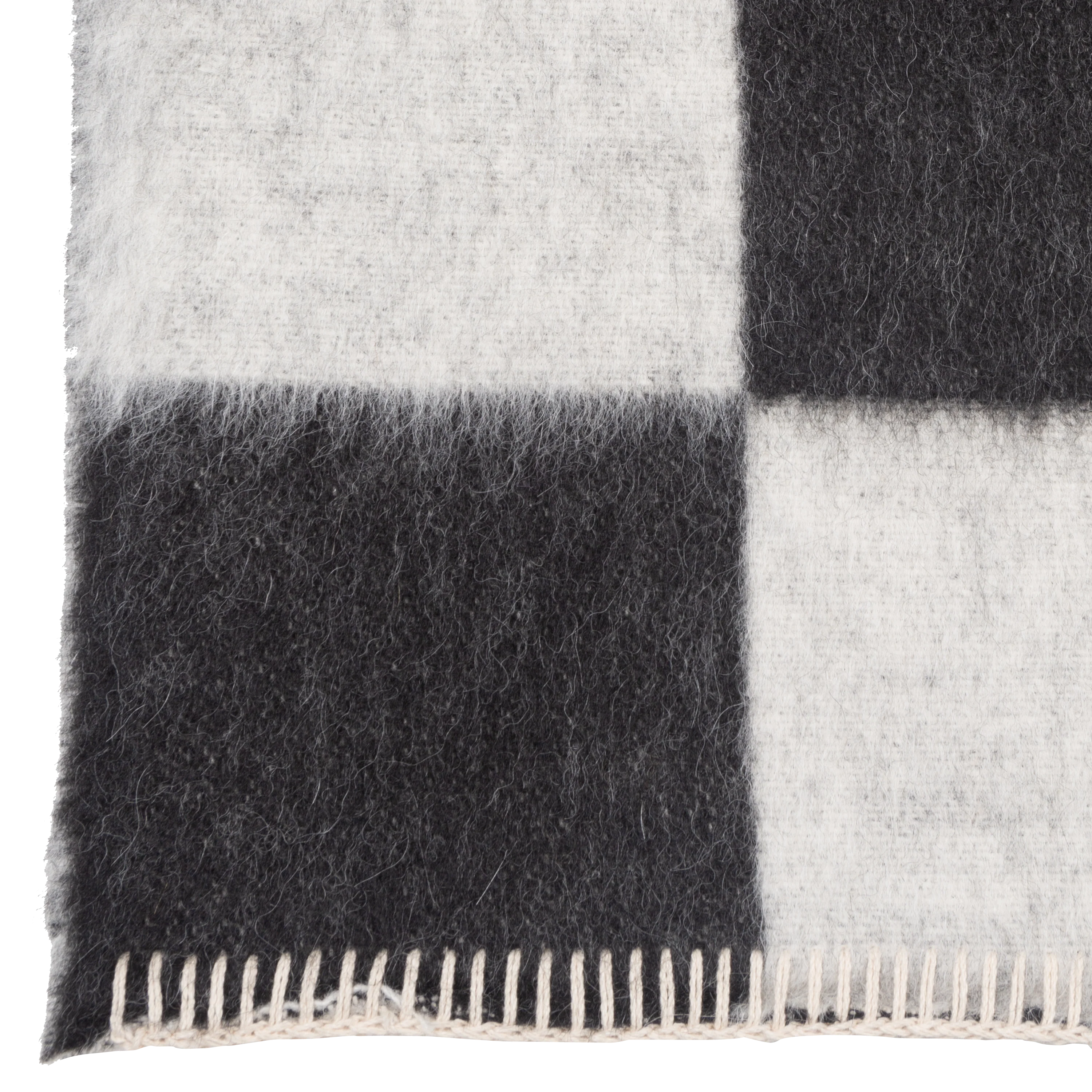 Presenting a luxuriously soft texture, the Crosby Check Throw is woven with natural superfine alpaca wool and undyed Peruvian cotton.