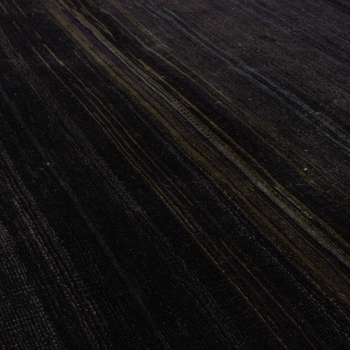 Through intricate weaves, knotting techniques and the use of colour, Elte's Solid and Textured rugs add warmth and depth to any space.