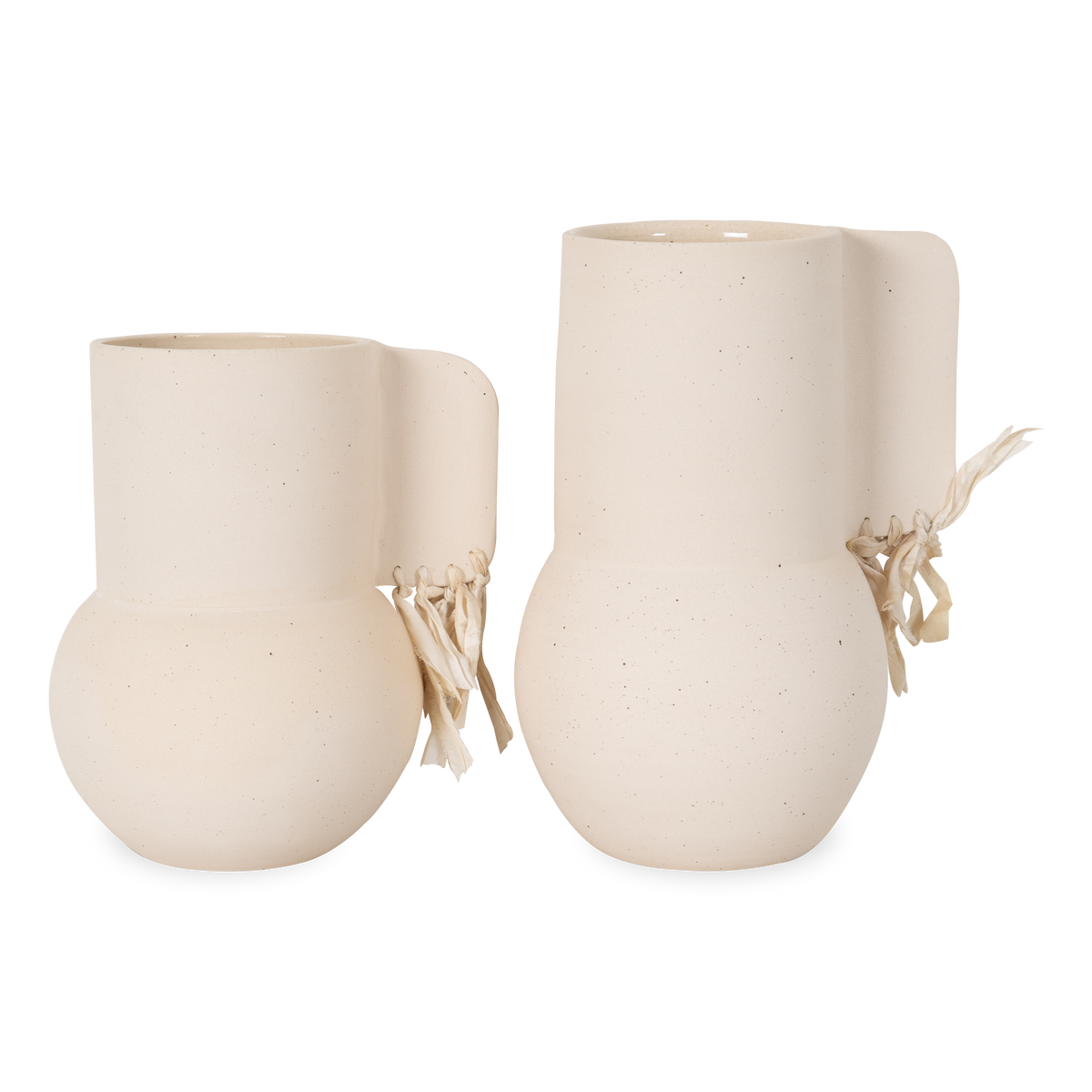 Characterized by simple and organic shapes, The Stoneware Vase is made of white specked stoneware.