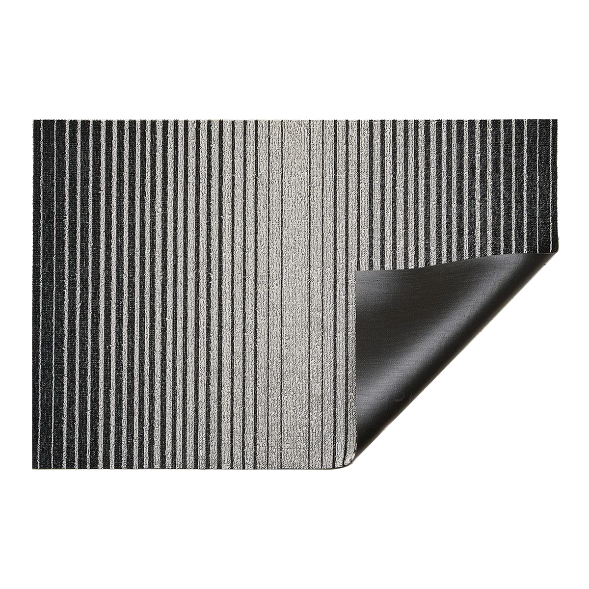 Inspired by the sharp contrast and mesmerizing motion of a cascading row of dominoes, the variegated stripes of this easy-care floor mat are at once dynamic and serene.